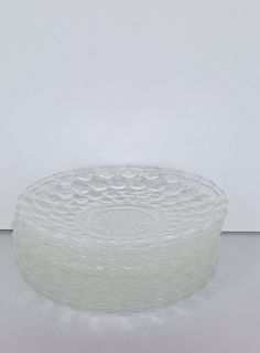 a glass bowl sitting on top of a white table