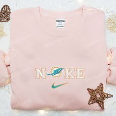 Nike x Miami Dolphins Logo Embroidered Hoodie, NFL Sports Embroidered Hoodie, Nike Inspired Embroidered Hoodie Varsity Hoodie With Embroidered Logo And Long Sleeves, Fan Apparel Hoodie With Embroidered Logo, Casual Sports Sweatshirt With Custom Embroidery, Casual Sweatshirt With Custom Embroidery For Sports, Pink Hooded Sweatshirt With Embroidered Logo, Pink Long Sleeve Hoodie With Custom Embroidery, Casual Embroidered Sports Sweatshirt, Casual Embroidered Sweatshirt, Sports Season Hooded Sweatshirt With Embroidered Logo