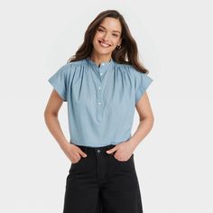 This Popover Short-Sleeve Blouse from Universal Thread™ makes a perfect pick for warm summer days. Fashioned in a casual fit, it features a front button placket and a curved hemline with side slits for relaxed style. The lightweight cotton fabric offers cool and comfortable all-day wear, and you can pair this blouse with your choice of pants or skirts to create a range of stylish outfits. Universal Thread™: Found exclusively at Target. Spring Tops With Placket For Daywear, Spring Placket Top For Daywear, Casual Cotton Blouse For Daywear, Spring Casual Tops With Placket, Casual Summer Blouse With Placket, Casual Spring Tops With Placket, Versatile Tops With Placket, Casual Spring Shirt For Daywear, Spring Casual Blouse With Placket