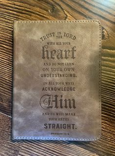 a leather bible cover with the words trust in your heart and do not lean on your own underhanding