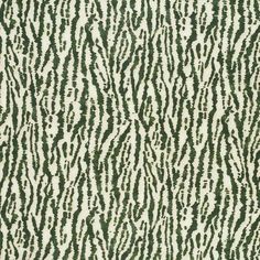 an animal print rug with green and white stripes