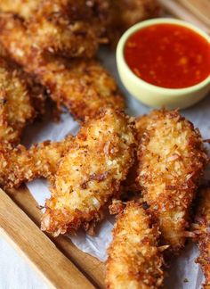 some fried food on a tray with dipping sauce