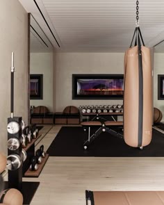 a gym with punching bags and other equipment