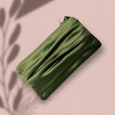 "Olive green wedding clutch wristlet. Available in two sizes. The regular size (4'x 8\") fits your cell phone and a few small items such as a lipstick and a compact powder. The larger size (10\"x5\") fits a small wallet, a cell phone, and a few make-up items. Dimension: Regular: 4\"X8\" Large: 5\"x 10\" Pleated detail on the front Fabric: satin  Made in the USA ** If ordered with name/ message inscription: Please note your inscription in the personalization box. ** If ordered with a photo lining Green Clutch Purse, Olive Green Wedding, Olive Green Weddings, Green Clutch, Green Clutches, Compact Powder, Green Gown, Wedding Clutch, Bridal Clutch