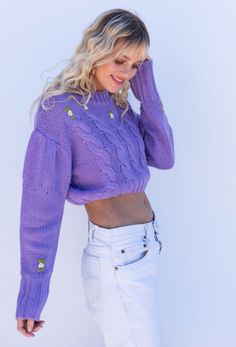 The Spring In The Alps Sweater features embroidered ivory flower detail, cropped body, contrast ribbed detail at neck, cuff and hemline and cable knit front design. Also comes in Ivory! Color: Lavender Embroidered Floral Detail Cropped Body Contrast Ribbed Detail Acrylic Model is 5'5", 32A Bust and wearing size Small Also Comes In Ivory Spring Crochet Tops, Purple Sweater With Ribbed Cuffs For Spring, Spring Cropped Cable Knit Top, Spring Cable Knit Cropped Top, Spring Fitted Cable Knit Cropped Sweater, Fitted Cable Knit Cropped Sweater For Spring, Cropped Cable Knit Top For Spring, Spring Cropped Cable Knit Sweater, Spring Crochet