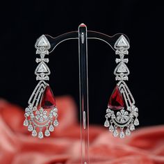 Bollywood traditional ethnic fashion Bridal party wear triangle zircon American Diamond stones and clear crystal rhinestone dangle earrings lady wedding jewellery. Earrings lock is press or post type.Rose gold and rhodium polished drop earrings jewellery can be used on marriage,engagement,birthday and any occasion. Earrings Length: 3.3 inches Party Hand Set Cubic Zirconia Chandelier Earrings, Party Chandelier Earrings With Cubic Zirconia, Diamond Teardrop Chandelier Earrings For Parties, Diamond Drop Chandelier Earrings For Party, Traditional Diamond Bridal Earrings For Party, Party Crystal Chandelier Earrings With Elegant Design, Elegant Crystal Chandelier Earrings For Party, Festive Cubic Zirconia Chandelier Earrings With Elegant Design, Red Diamond Earrings With Accents For Wedding