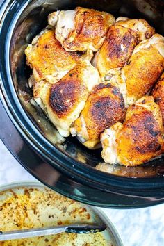 the chicken is in the slow cooker and ready to be cooked with it's meat