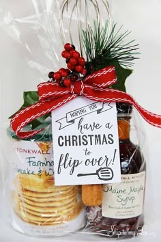 a bag filled with cookies and jams next to a sign that says have a christmas flip over