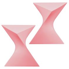 two pink tables sitting next to each other