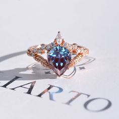 2 Carat Pear Shape Alexandrite Floral Gold Rose Gold Ring Sapphire Side Stones, Ring Model, Alexandrite Engagement Ring, Alexandrite Ring, Rose Gold Engagement, Buying Diamonds, Gold Engagement Ring, Rose Gold Engagement Ring, American Jewelry