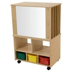 a wooden toy shelf with three bins and a mirror on the top one side