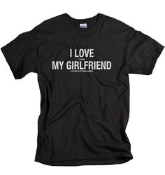 a black t - shirt with the words i love my girlfriend printed on it in white