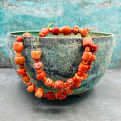 A stunning strand of antique coral beads at a very good prize! These lmatching mediterranean coral beads are a must have for your tribal and ethnic jewelry projects! Last picture gives some inspiration! For more sets and strand, click here: https://creatoriq.cc/3DZZXNZ ✔️ Shape: corn and small tube beads ✔️ Weight: 45 grams ✔️ Size bead: 4-10 mm, diameter 5-12 mm ✔️ Total length: ca 42 cm ✔️ Temporarily strung ✔️ Origin: Mediterranean Sea ✔️ Condition: very good, consistent with age and use ✔️ T Traditional Coral Gemstone Beads, Orange Bohemian Red Coral Beads, Bohemian Orange Red Coral Beads, Coral Bohemian Polished Beads, Bohemian Coral Gemstone Beads, Bon Prix, Unique Bracelets, Coral Beads, Beads For Jewelry Making