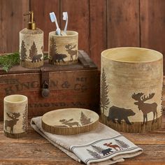 moose themed bathroom accessories including soap dispenser, toothbrush holder and cup