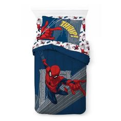 a spiderman bedding set with blue and red sheets