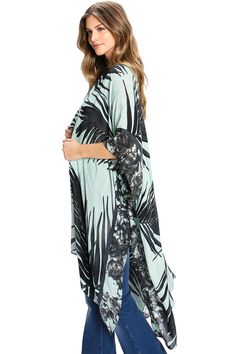 Airy kimono cardigan featuring a bold, oversize palm leaf print. Draping silhouette with 3/4 length kimono sleeves. Super soft and light weight fabric looks great layered with many different looks! CARE | Hand Wash Cold or Dry Clean CONTENTS | 100% Viscose MEASUREMENTS | 36"/92 cm Top to Bottom (Size O/S) MODEL | 5'8 - wearing O/S IMPORTED Summer Beach Kimono With 3/4 Sleeves, Casual Oversized Printed Cover-up, Spring Beach Kimono With 3/4 Sleeve, Oversized Casual Kimono For Layering, Oversized Long Sleeve Kimono For Beach Season, Palm Leaves Print, Kimono Sleeves, Kimono Cardigan, Kimono Sleeve