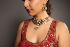 Our Shreya Jewelry Set is simple and elegant. This beauty is designed with premium quality kundan and hand-painted back meenakari. Hand-crafted to perfection, this two-layered kundan necklace set includes a neckace a pair of earrings, and a Maang Tikka. This lovely jewelry set will elevate any Western or Indian outfit on all occasions. Specifications Materials used: premium-quality kundan, high gold plating At Romikas, we pride ourselves on the craftsmanship and high quality of our jewelry, desi Party Kundan Necklace With Zari Work, Party Kundan Necklaces With Zari Work, Kundan Meenakari Temple Necklace For Party, Kundan Necklace With Gota Work, Temple Jewelry Kundan Necklace For Diwali, Silver Kundan Necklace With Gota Work For Diwali, Festive Silver Kundan Necklace With Zari Work, Kundan Chandbali Necklace With Mirror Work, Festive Kundan Necklace With Mirror Work As Gift