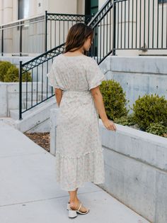 Looking for a dress that will make you stand out in a crowd? Look no further than the Floral Pattern Whitney Dress in mint floral! This dress is all about fun and flirty style, with a colorful floral print that's sure to turn heads. But it's not just about looks - this dress is designed to flatter your curves, with a tie waist that accentuates your figure. And with flutter sleeves and a midi length, it's the perfect combination of playful and sophisticated. Whether you're headed to a wedding, a Modest V-neck Floral Print Dress, Feminine Floral Print Dress For Day Out, Modest Maxi Dress With Ditsy Floral Print For Brunch, Feminine Floral Print Maxi Dress For Day Out, Modest Flowy Floral Print Midi Dress, Modest Floral Print Maxi Dress For Spring, Spring Ditsy Floral Print Midi Dress For Daywear, Flowy Maxi Floral Dress With Ditsy Print, Spring Midi Dress With Ditsy Floral Print For Daywear