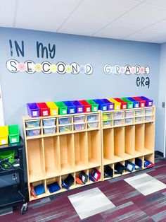 there are many bins on the shelves in this classroom