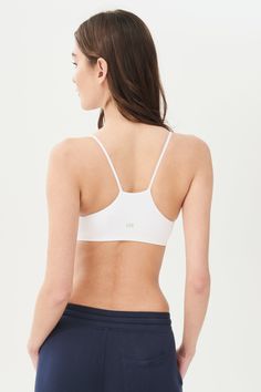 An easy to wear seamless bra designed to go from gym to everyday...seamlessly. Chafe-free fabric lets you move with easy and layers beautifully under any top. BEST FOR: running, yoga, crossfit, barre, pilates, spin class or gym workouts. Model is 5'10" and wears a size XS/S. Micro-elastic Seamless Tops For Training, Seamless Fitted Bra With Light Support, White Seamless Crop Top With Minimal Stretch, Functional Fitted Seamless Bra, Fitted Bra With Light Support And Seamless Fabric, Sporty Seamless Training Bra, Athleisure Fitted Seamless Bra, Seamless Fitted Athleisure Bra, Fitted Seamless Athleisure Bra