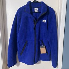 North Face Campshire Fleece Jacket Blue Full Zip Long Sleeve Sherpa Retail $140.00 Measurements: Pit To Pit Is 23” Shoulder Down Is 26” Ultra-Warm, And Equally Soft, Sherpa Fleece Full-Zip Jacket For Getting A Little More Comfortable At The Mountain Cabin. Features: Standard Fit High-Pile, 300-Weight Campshire Sherpa Fleece Reverse-Coil Center Front Zip Secure-Zip Welt Hand Pockets The North Face Fleece Jacket For Cold Weather, The North Face Winter Fleece Jacket, The North Face Winter Fleece Jacket For Cold Weather, The North Face Fleece Jacket For Winter, The North Face Fleece Jacket For Winter Hiking, Blue Outerwear For Camping In Fall, Blue Outerwear For Fall Camping, The North Face Winter Fleece Jacket For Hiking, Blue Fleece Jacket For Fall