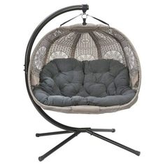 a swing chair with grey cushions and black stand