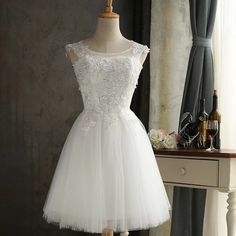 Lace bridesmaid dresses, short, slim white dress, sister dresses, sleeveless homecoming dressesMaterial:tulleColor:as picture or custom colorNeckline:o-neckBack details:bandageStyle:simpleDress type:A-line&ltp&gtFeatures:lace</p>&ltbr/>&ltp&gtCustomized service and Rush order are available.</p>&ltbr/>&ltp&gtThis dress could be custom made, there are no extra cost to do custom size and color.</p>&ltbr/>&ltp&gtPlease leave your phone number for shipping when you order the dress.</p>&ltbr/>&ltp&gt1 White Knee-length Bridesmaid Dress, White Bridesmaid Dress With Lace Bodice, White Sleeveless Homecoming Dress, White Sleeveless Dress For Homecoming, White Knee-length Dresses For Bridesmaids, White Knee-length Dress With Lace Bodice, Summer Wedding White Bridesmaid Dress, White Prom Dress For Prom Season, Knee-length Tulle Mini Dress For Wedding