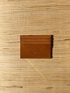 Sleek and simple, this leather card holder is an easy way to elevate your lifestyle. Hand made using vegetable tanned natural smooth navy leather, it has one internal pocket and 3 credit card slots on each side, and is lined with printed fabric. Height: 3.4" Width: 4.5" Depth: 0.4" Made in Argentina Casual Leather Card Holder, Casual Leather Card Holder With Interior Slots, Casual Business Card Holder With Interior Slots, Casual Bifold Leather Card Holder, Casual Brown Leather Card Holder, Casual Leather Card Holder With Card Slots, Casual Card Holder With Interior Slots For Everyday Use, Casual Everyday Card Holder With Coin Pocket, Casual Leather Card Holder With Slots