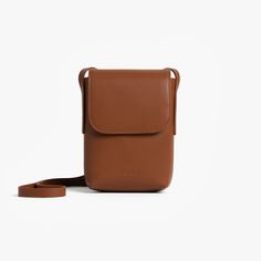 Mahogany (Vegan Leather) | Front view of Metro Mini Crossbody Mahogany Travel Cubes, Packing Organizers, Luggage Shop, Luggage Cover, Travel Jewelry Case, Luggage Sets, Travel Jewelry, Daily Essentials, Mini Crossbody