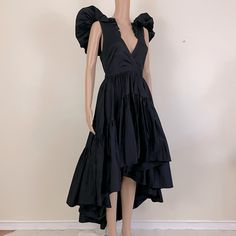 This Dress Is Based On One Of The Winning Looks From The Fashion Competition Show Making The Cut. It Is Fabulously Constructed With A Lot Of Unique Details. It’s A V-Neck With A Puff Sleeve And A Tie Back. The Skirt Is Tiered And Flared With A High Low Hem. A Size Extra Small. Black High Low Dress, Making The Cut, Cut Dresses, Fashion Competition, Cut It, Dress Cuts, High Low Hem, Tie Backs, Tie Back