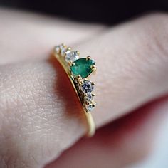 A lustrous pear shape emerald is set with a row of shiny CZs. This ring reminds us of somewhere royal. Handcrafted in 14K solid gold. Materials: - 14K solid gold - Natural 0.20ct pear shape emerald. 4*3mm - Top 5A grade CZ This item is specially made for you. Please allow 1-2 week lead time. Online Return Policy: Due to the made-to-order nature of our jewelry. All products are final sale. Please email us if you are unsure. Elegant Gold Pear-shaped Emerald Ring, Gold Pear-shaped Emerald Diamond Ring, Gold Emerald Diamond Ring With Pear Shape, Emerald Gem, Ring Settings, Gold Top, Lovely Ring, Ring Photos, Dainty Ring