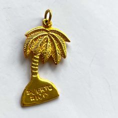 Vintage Souvenir Palm Tree Charm From Puerto Rico. The Charm Is Stamped 14k On The Back . Mint Condition Vintage 14k Yellow Gold Charms, Luxury Gold Vintage Charms, Vintage Gold-tone Charms For Gifts, Gold Palm Tree, Luxury Yellow Gold Vintage Charms, Vintage Yellow Gold-plated Charm, Vintage Souvenir, Palm Tree, Mint Condition