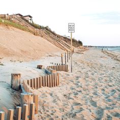 there is a street sign on the beach