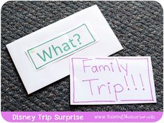 two stickers with words on them that say, what? family trip and disney trip surprise