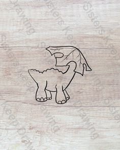 a wooden cutting board with a drawing of a dragon on it's back side