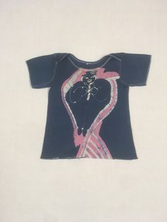 vintage 1970s baby t-shirt cotton hand dyed batik of a man on front and semi abstract sunrise/sunset over horizon on back light wear inc. back tear at hem-see photos no tag, cotton feel, baby size, see below measures, shoulder-8 1/4" chest-10" sleeve-3 1/2" length-13" Vintage Hand Printed Short Sleeve T-shirt, Vintage Hand Printed Crew Neck Tops, Vintage Hand-printed Short Sleeve T-shirt, Fitted Acid Wash Short Sleeve T-shirt, Fitted Acid Wash T-shirt, Artistic Tie Dye Cotton Tops, Vintage Hand Printed Cotton Top, Vintage Tie Dye Top With Screen Print, Vintage Tie-dye Top With Screen Print