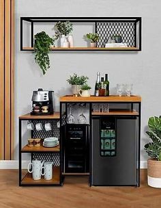 two shelves with plants, cups and other items on them in front of a wall