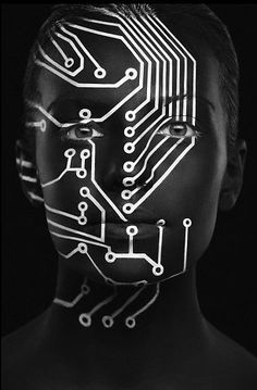 a woman's face with electronic circuit printed on it