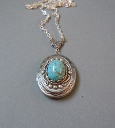 "I set a stunning Beautiful Turquoise Glass Cabs cabs in a classic oval locket in antiqued silver. The locket has a simple vintage-inspired design engraved on the front and back. The locket is 1.25\" X 1\" (3 cm X 2.5 cm) with space inside for you to place your special photo. The locket is connected to a 24-inch chain by a rosary-style connector. The locket is packaged in a lovely little silhouette box, set on a soft piece of white cotton. ♥ * ♥ * ♥ * ♥ * ♥ * ♥ * ♥ * ♥ © Original design by Twili Necklace Photo, Silver Locket Necklace, Oval Locket, Silver Locket, Turquoise Glass, Silver Lockets, Photo Locket, Robins Egg, Vintage Inspired Design