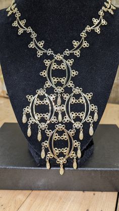 "Lovely mid-century fancy pendant necklace with gold tone filigree and dangles.  Light stamped metal but has the delicate look of Edwardian elegance.  The necklace opening is 18\" long and the pendant is 5\" tall and 3\" wide.Please check out my shop for all kinds of gift ideas. Vintage and Contemporary options: https://mrmugginsmarket.etsy.com" Fancy Pendant, Filigree Pendant Necklace, Stamped Metal, Ideas Vintage, Filigree Pendant, Metal Stamping, Pendant Necklaces, Necklace Etsy, Jewelry Necklace Pendant