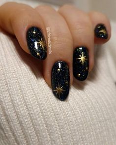 With sparkles, gold, silver, or fun holiday designs, New Year’s Eve nails can help you feel extra fabulous as you welcome a new beginning. Here are 50 nail ideas to inspire your next holiday manicure. Night Sky Themed Nails, Dark Colored Nail Designs, Navy Celestial Nails, Stars Moon Nails, Dark Celestial Nails, Moon And Stars Nail Designs, Dark Academia Nails Aesthetic, Nail Designs Celestial, Short Celestial Nails