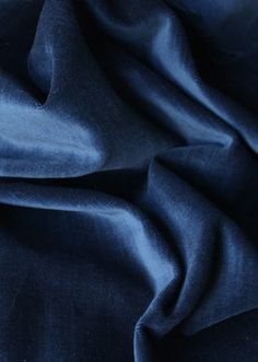 an image of a blue cloth textured with fabric material that is soft and smooth