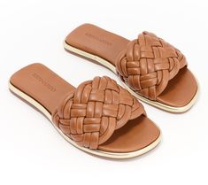 A beautiful blend of leisurely and luxurious looks, this leather sandal's woven slip-on design goes from poolside to patio party in a fashionable flash. From Bernardo. Casual Sandals With Intrecciato Weave For Vacation, Luxury Synthetic Sandals For Vacation, Casual Intrecciato Weave Sandals For Vacation, Luxury Synthetic Sandals For The Beach, Luxury Slide Sandals For Beach, Luxury Synthetic Beach Sandals, Luxury Beach Slide Sandals, Luxury Woven Leather Sandals For Summer, Leather Sandals With Woven Sole For Summer Outings