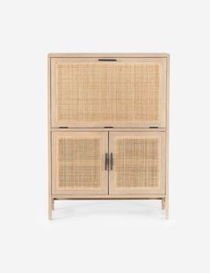 a wooden cabinet with two doors and wicker panels on the front, against a white background