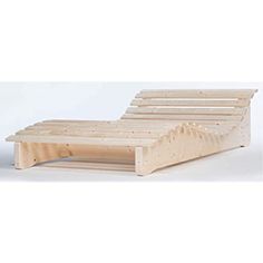 a wooden bed frame sitting on top of a white floor