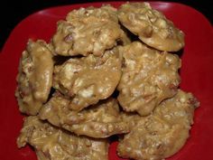 a red plate topped with cookies covered in peanut butter