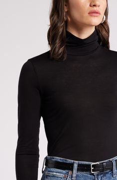 Lightweight, soft and warm, this trim turtleneck is also versatile, ensuring its place at the top of your rotation. Turtleneck Long sleeves 70% Tencel® lyocell, 30% wool Tencel lyocell is a more-sustainably produced fiber made with closed-loop processing Machine wash, tumble dry Imported High Neck Elastane Turtleneck For Layering, High Neck Turtleneck For Layering, Winter Long Sleeve Turtleneck In Elastane, Winter Long Sleeve Elastane Turtleneck, Long Sleeve Elastane Turtleneck For Winter, Black Elastane Turtleneck For Fall, Fall Turtleneck Mock Neck Top In Elastane, Long Sleeve Elastane Turtleneck For Layering, Nordstrom Long Sleeve Tops For Fall