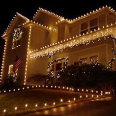 a house covered in christmas lights at night