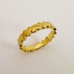 "14K / 18K Solid Gold Hearts Wedding Band Ring for Woman, Unique Delicate Ring made of Yellow, White, Rose Gold. This ring is engraved with four hearts connected with curved ornaments, inspired by \"Americana\" graphic style. It is a delicate ring with a unique, simple and sweet design. Made by hand out of wax, each shape is unique and create harmonious flowing. Dainty and stylish, it is a vivid and optimistic design to mark the endless love that connect our circle of life and create strong beau Yellow Gold Jewelry For Wedding On Valentine's Day, Yellow Gold Jewelry For Valentine's Day Wedding, Formal Gold Heart Ring With Diamond Cut, Yellow Gold Wedding Jewelry For Valentine's Day, Heirloom 22k Gold Wedding Rings, Gold Heart Ring With Diamond Cut For Wedding, Gold Diamond Cut Heart Ring For Wedding, 22k Gold Engraved Heirloom Wedding Ring, Gold Heart Ring For Wedding Fine Jewelry