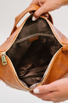 The Reese Backpack comes in two sizes (standard and oversized) to fit all you'll need to carry on the go, without looking like you're about to check your luggage. Toss in any size laptop, books, keys, wallet, and even an extra pair of shoes... without looking like you're about to go on a 12-mile hike! Each gorgeous neutral color comes in ultra-soft and durable vegan leather. The Reese features adjustable backpack straps and a top handle for a quick grab. It has two exterior pockets (one front an Large Capacity Laptop Backpack For Travel, Brown Backpack With Zipper Pocket For On-the-go, School Shoulder Bag With Zipper Closure, School Shoulder Bag With Zipper, Brown Bags With Zipper Closure For Back To School, Back To School Satchel With Zipper Closure, School Backpack With Zipper Closure And Double Handle, Back To School Shoulder Satchel With Zipper Closure, Back To School Shoulder Satchel With Zipper